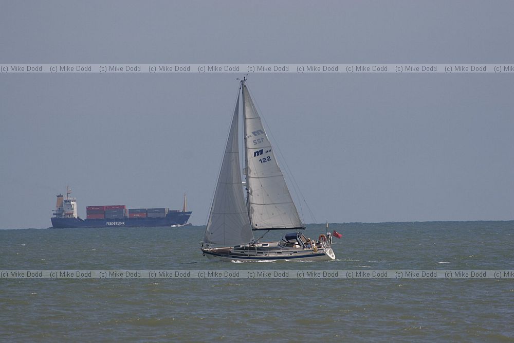 Yacht and container ship