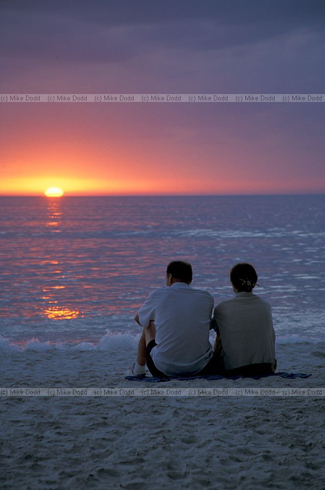 People and sunset on beach Florida